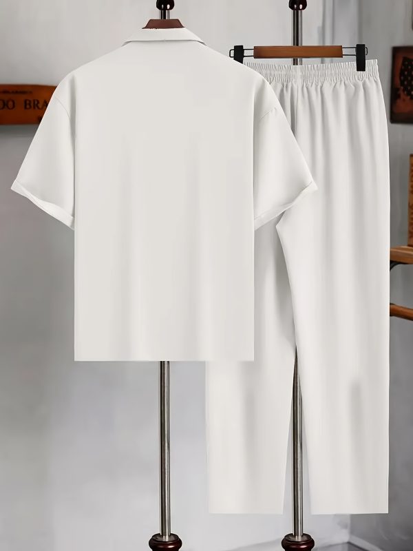 new products in 2025, a 2pcs set of summer simple men's short sleeved shirt and long pants. the white short sleeved shirt is paired with long pants in the same color system. the style is casual and elegant, suitable for daily outings.